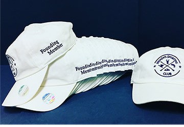 Club member caps with multi-line embroidered text