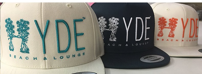 High-relief embroidered lettering on snapbacks for Hyde Beach and Lounge