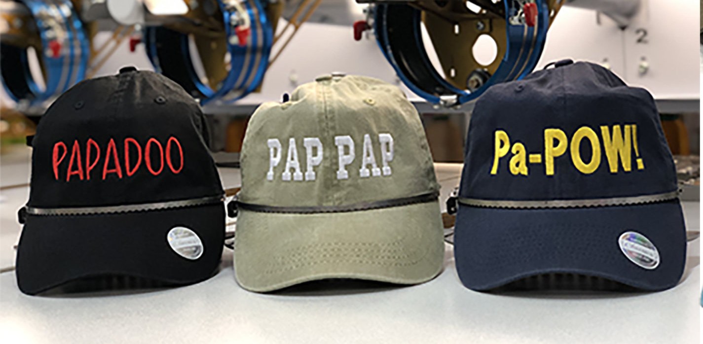 Custom rope caps on the embroidery machines in our studio
